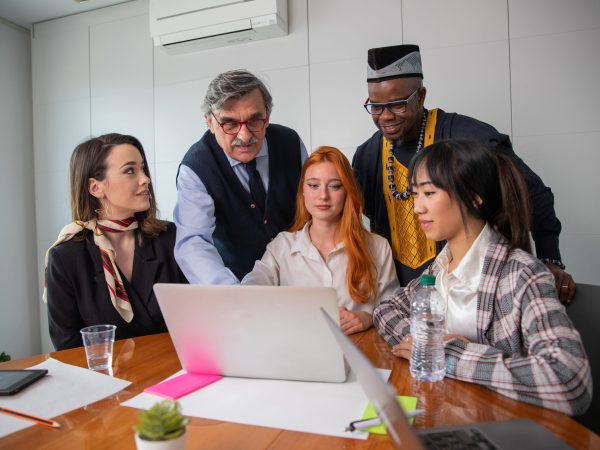 Colleagues working on a project in an office, multi-ethnic group